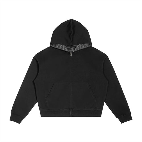Black oversized zip hoodie with a contrast plaid hood lining, drop shoulders, and front pockets.