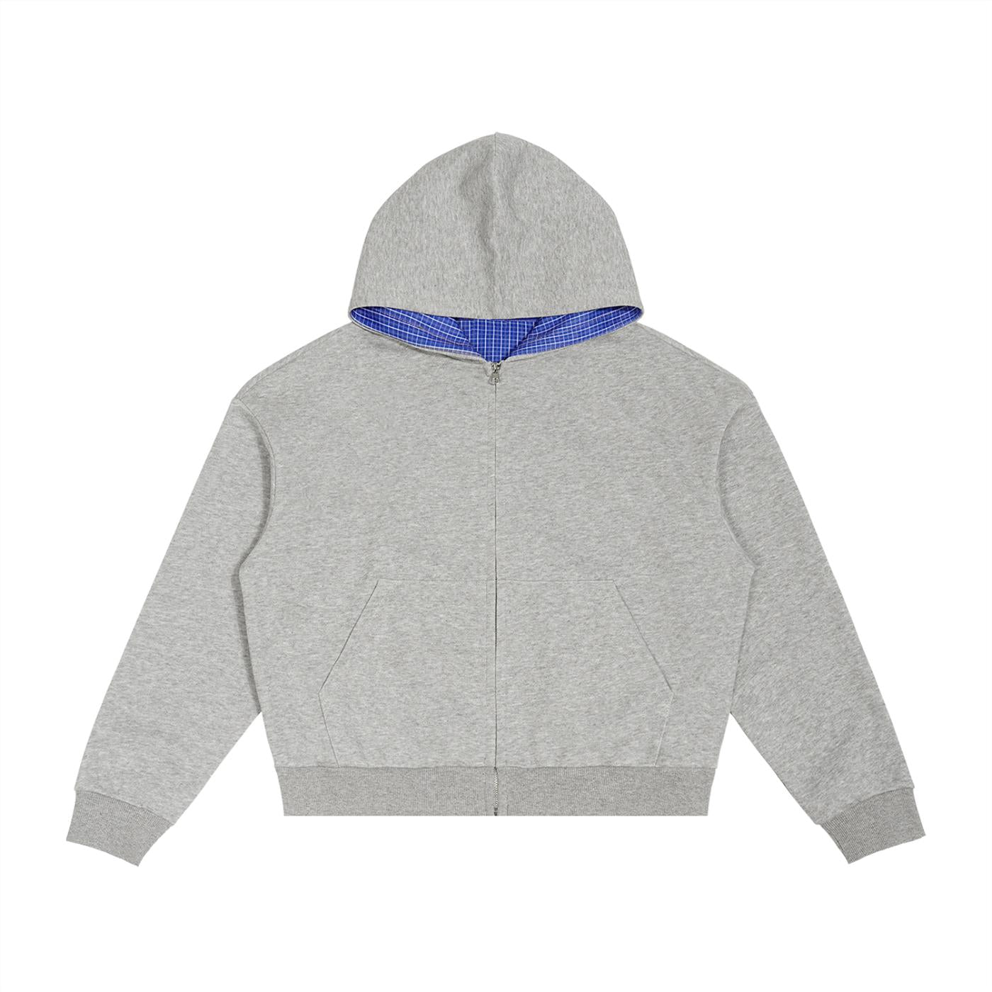 Grey cotton blend boxy zip hoodie with a blue plaid contrast hood lining and front pockets.