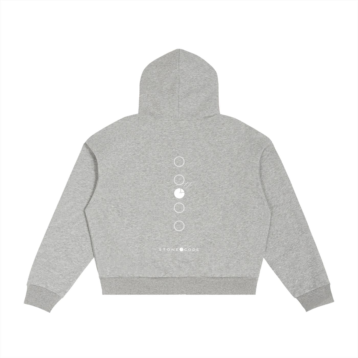 Back view of a gray cotton blend zip hoodie with a white circular graphic design and "STONE CODE" text.