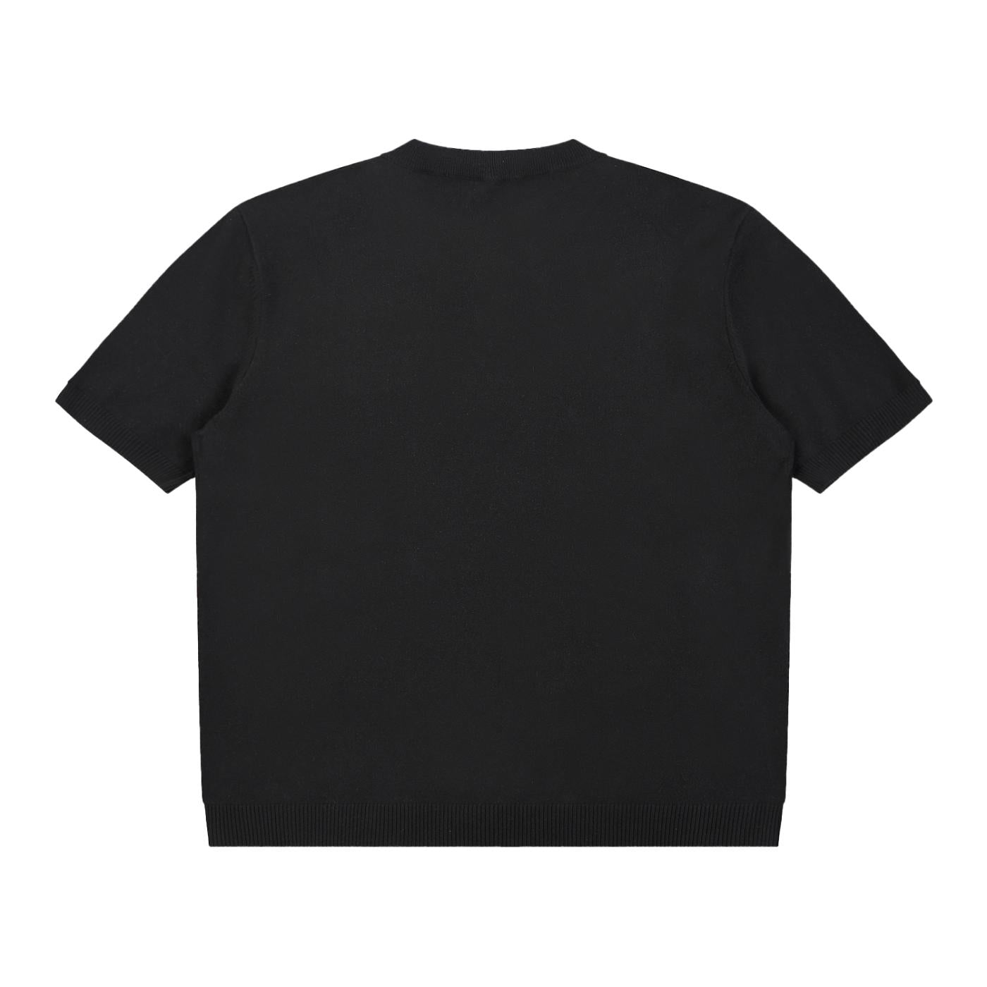 Back view of a black oversized cotton knit short sleeve Henley t-shirt with a ribbed hem and cuffs.