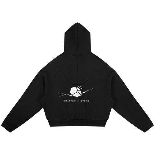 Black oversized raglan hoodie with a white "Written in Stone" graphic on the back.