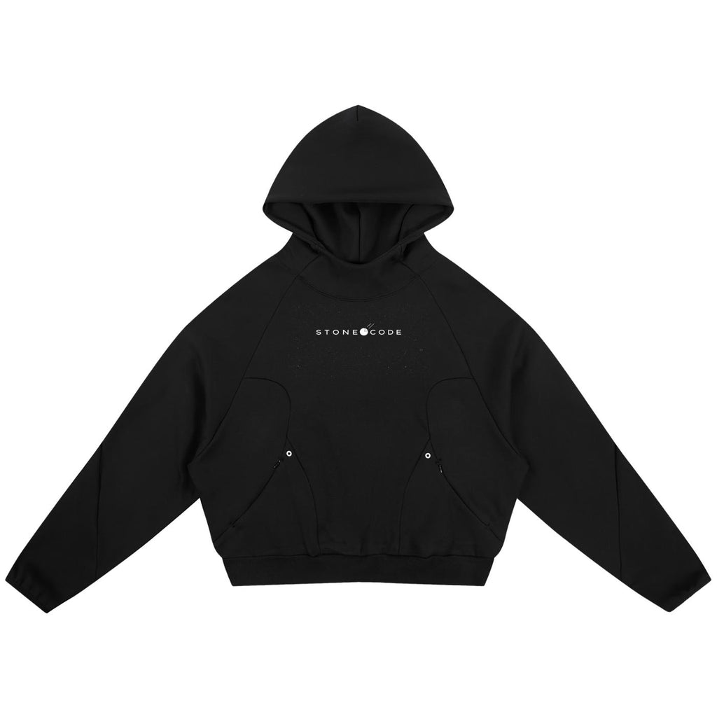 Black oversized raglan hoodie with white "STONE CODE" print, curved panels, and zippered pockets.