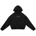 Black oversized raglan hoodie with white "STONE CODE" print, curved panels, and zippered pockets.