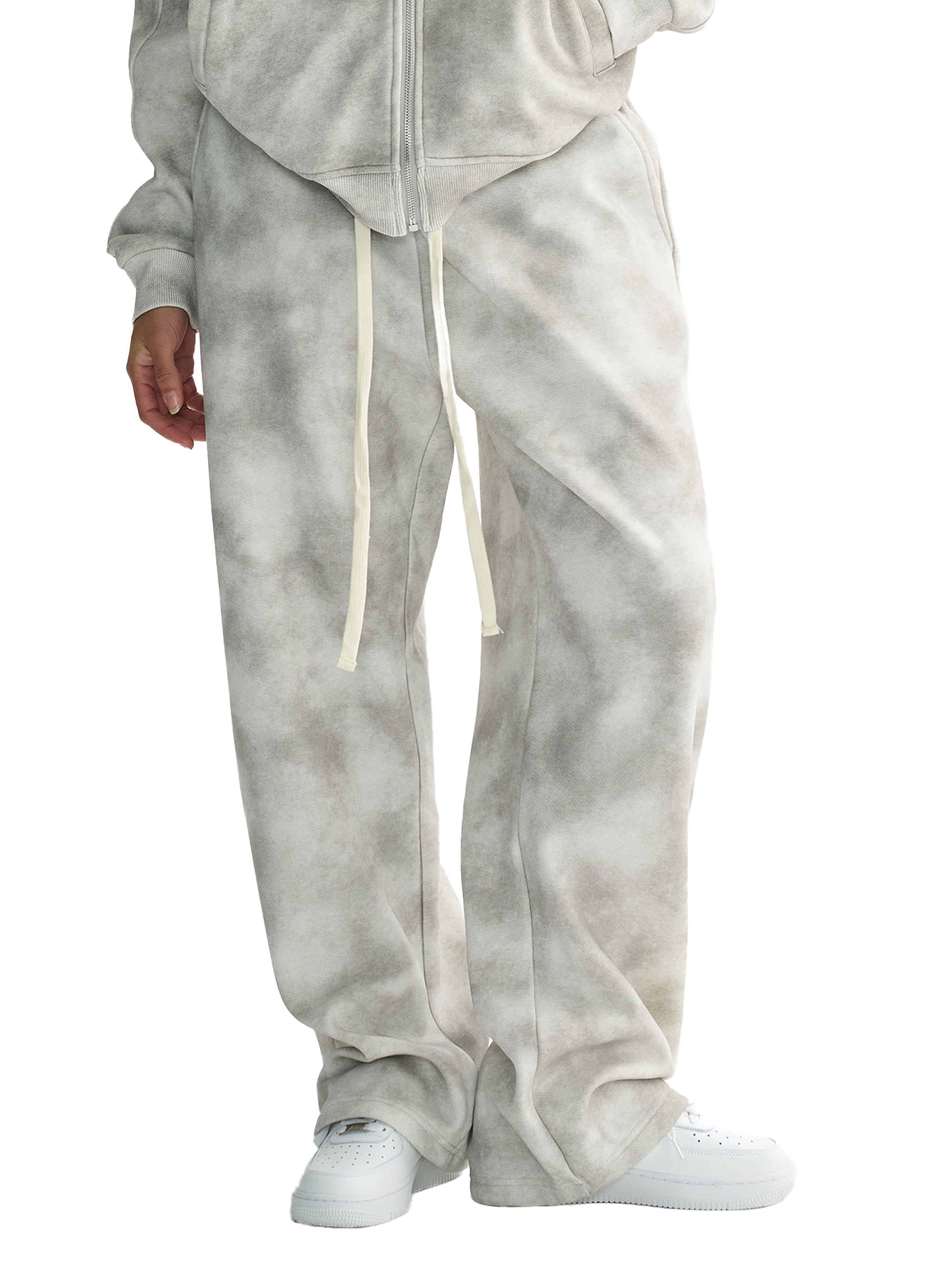 Unisex dirty washed fleece sweatpants in grey with a loose fit, drawstring, and mid-waist design.