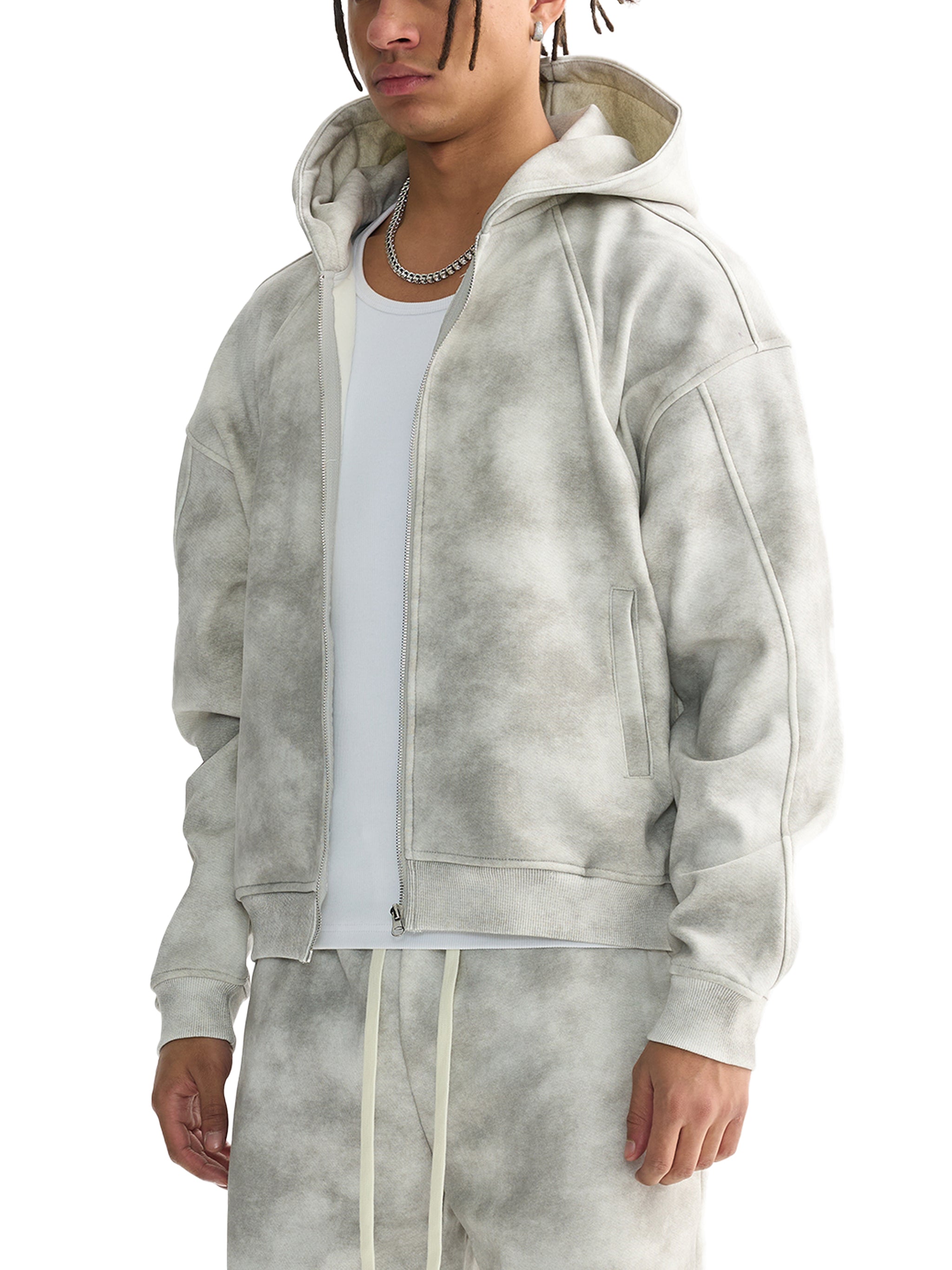 Unisex dirty washed grey zip-up fleece hoodie with pockets, worn over a white tee and matching sweatpants.