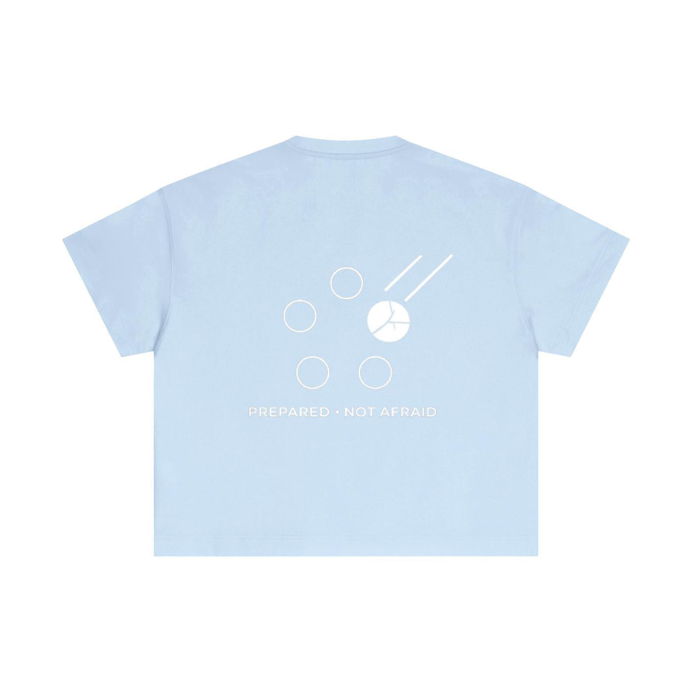 Light blue cotton boxy t-shirt with a white graphic design and "PREPARED • NOT AFRAID" text on the back.
