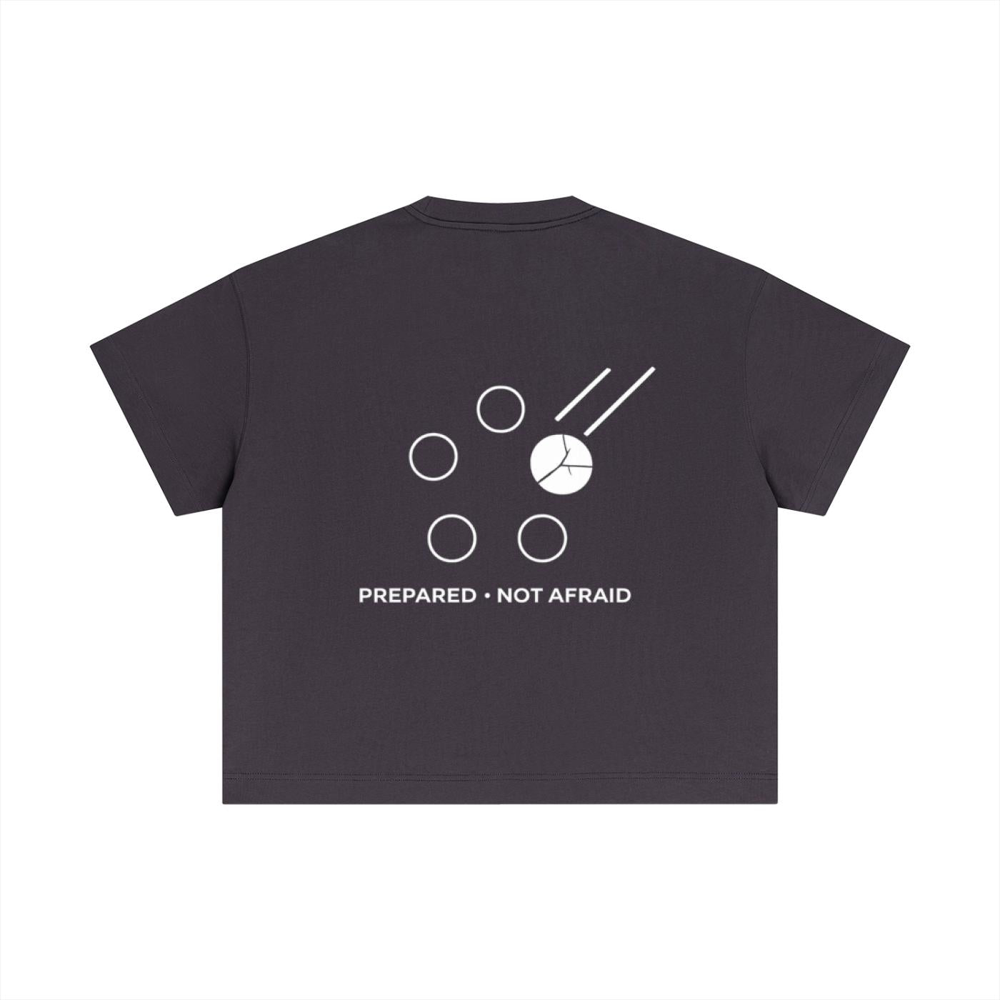 Back of a dark grey essential cotton boxy t-shirt with a white "PREPARED • NOT AFRAID" graphic.