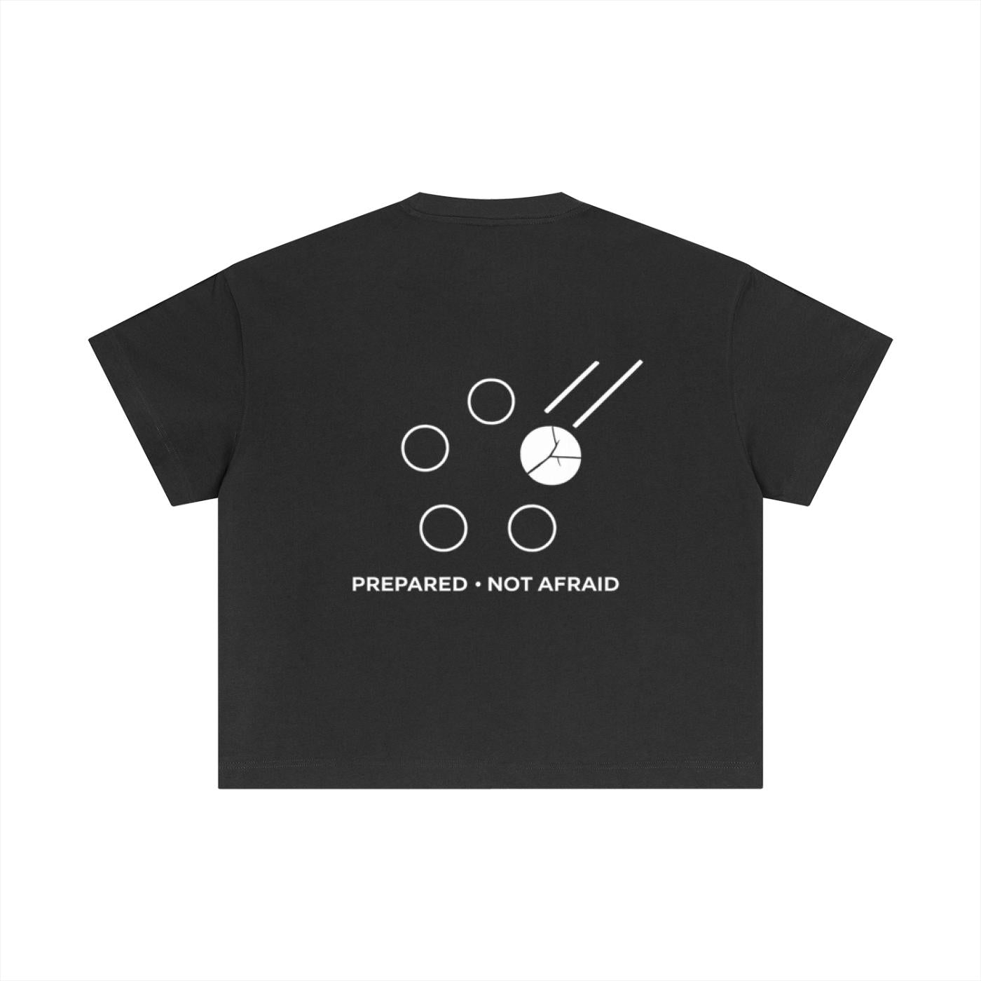 Black cotton boxy t-shirt with white graphic of circles and lines, "PREPARED • NOT AFRAID" text.