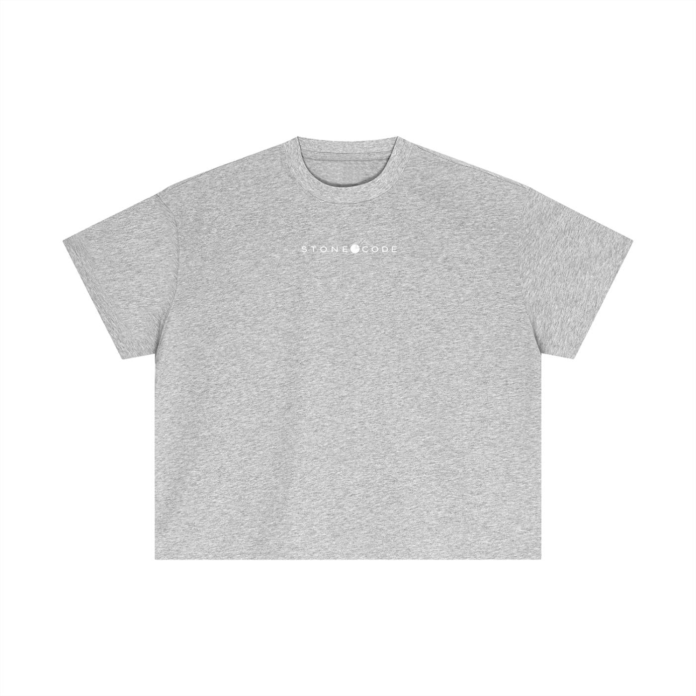 Light grey essential cotton boxy t-shirt with "STONE CODE" logo, short drop sleeves, and round neck.