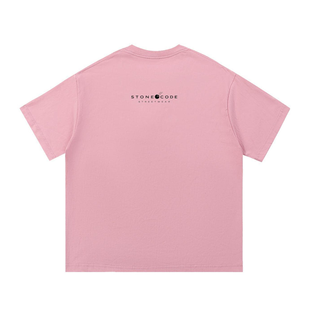Back of a pink 100% cotton Essential T-Shirt with "STONE CODE STREETWEAR" logo in black.