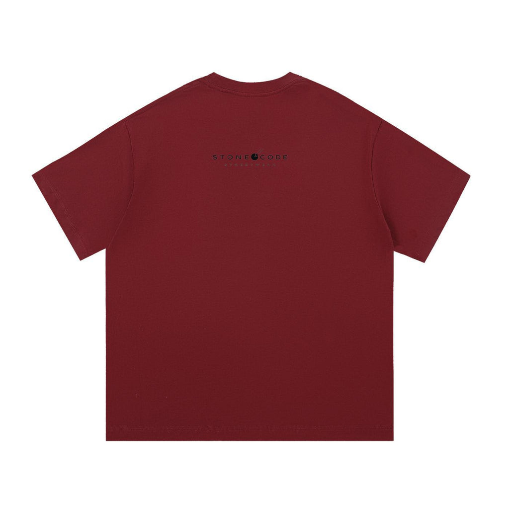 Back view of a loose-fit, regular sleeve, round neck, pure cotton maroon t-shirt with a black "STONE CODE" logo.