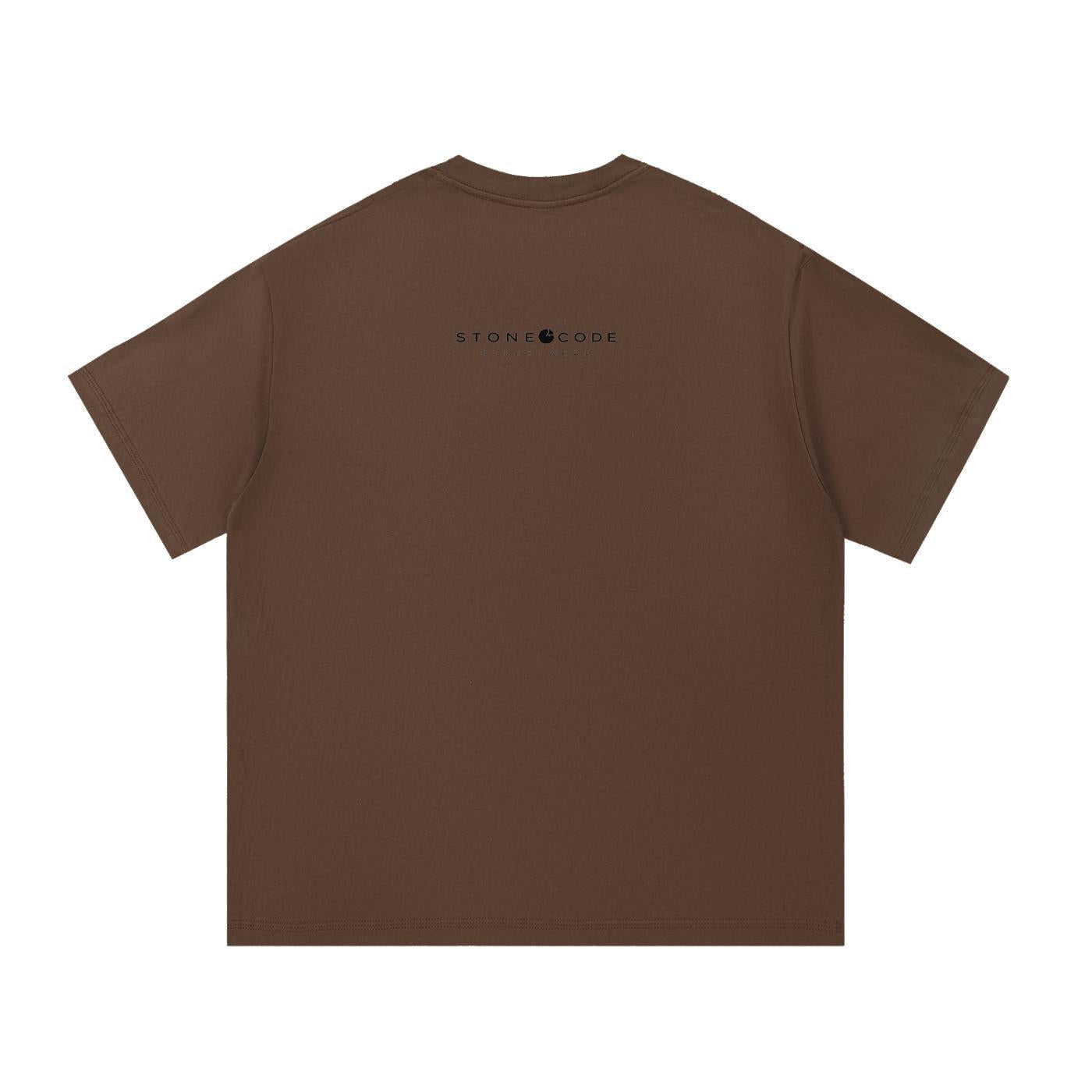 Brown 100% cotton unisex regular fit t-shirt with short sleeves and a round neck, featuring a small black "STONE CODE" logo on the upper back.