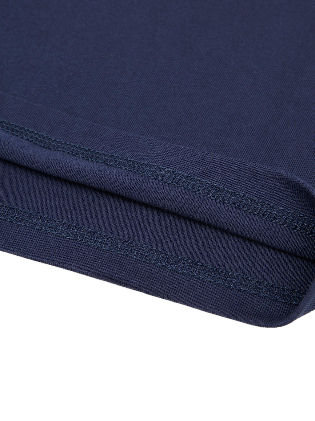 Close-up of the navy blue 100% cotton Essential T-Shirt hem, showing double-stitched detail.