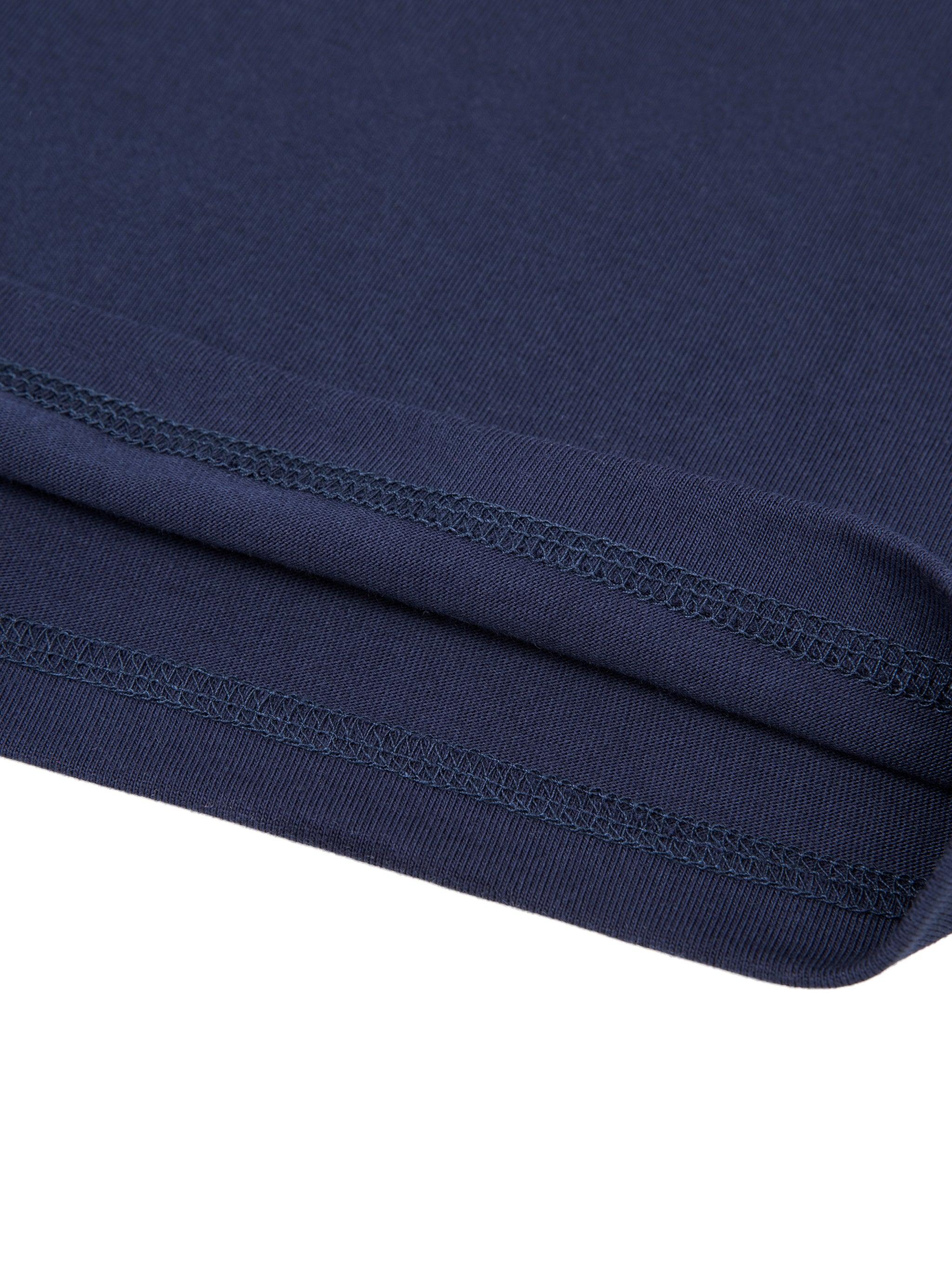 Close-up of the navy blue 100% cotton Essential T-Shirt hem, showing double-stitched detail.