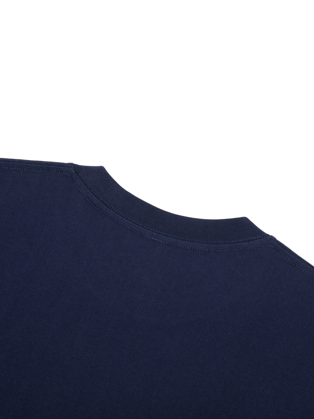 Close-up of a navy blue 100% cotton Essential T-Shirt, showing the round neck and fabric texture.