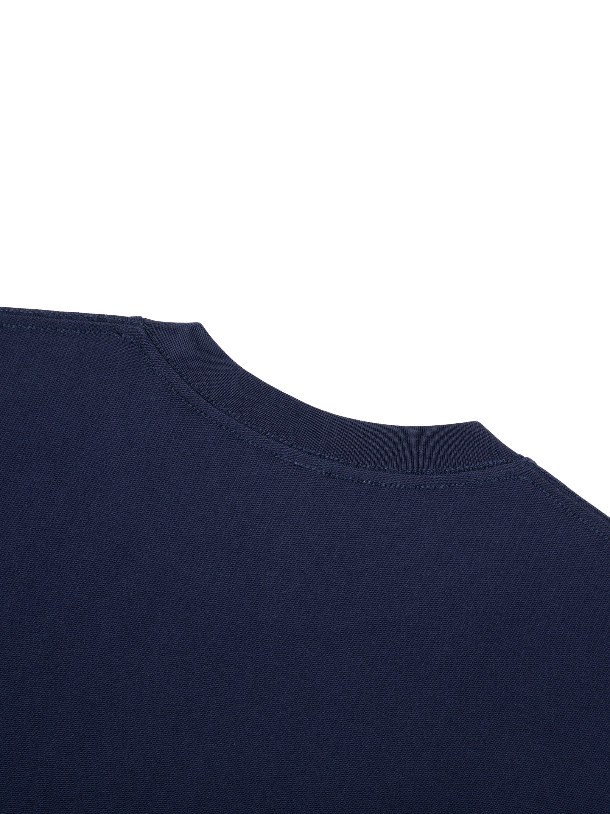 Close-up of a navy blue 100% cotton Essential T-Shirt, showing the round neck and fabric texture.