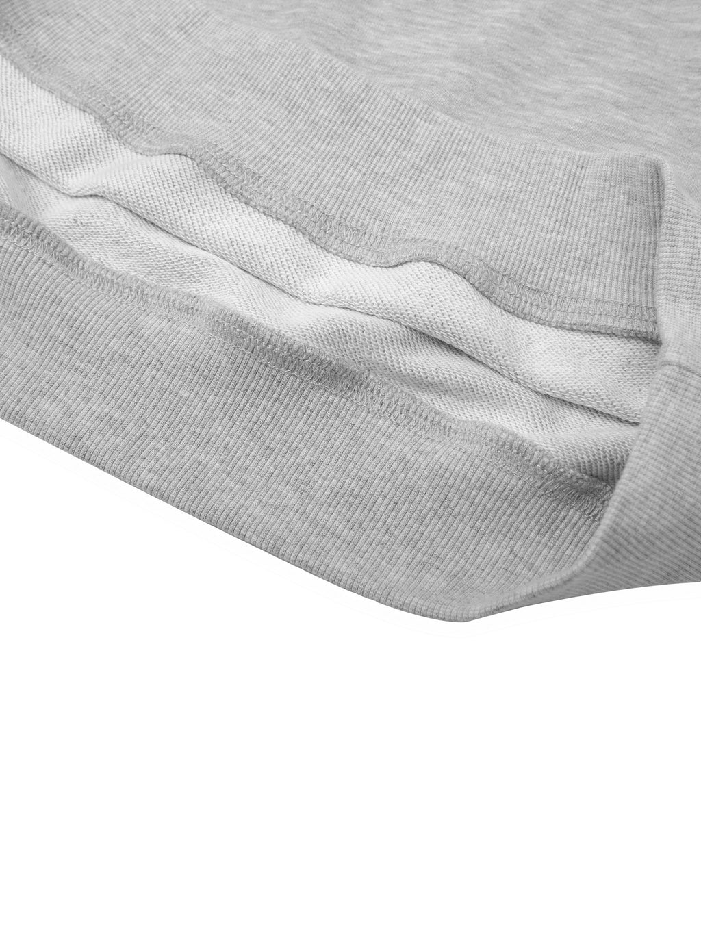 Close-up of a light grey cotton blend cropped hoodie, showing ribbed cuffs and hem, and soft inner fabric.