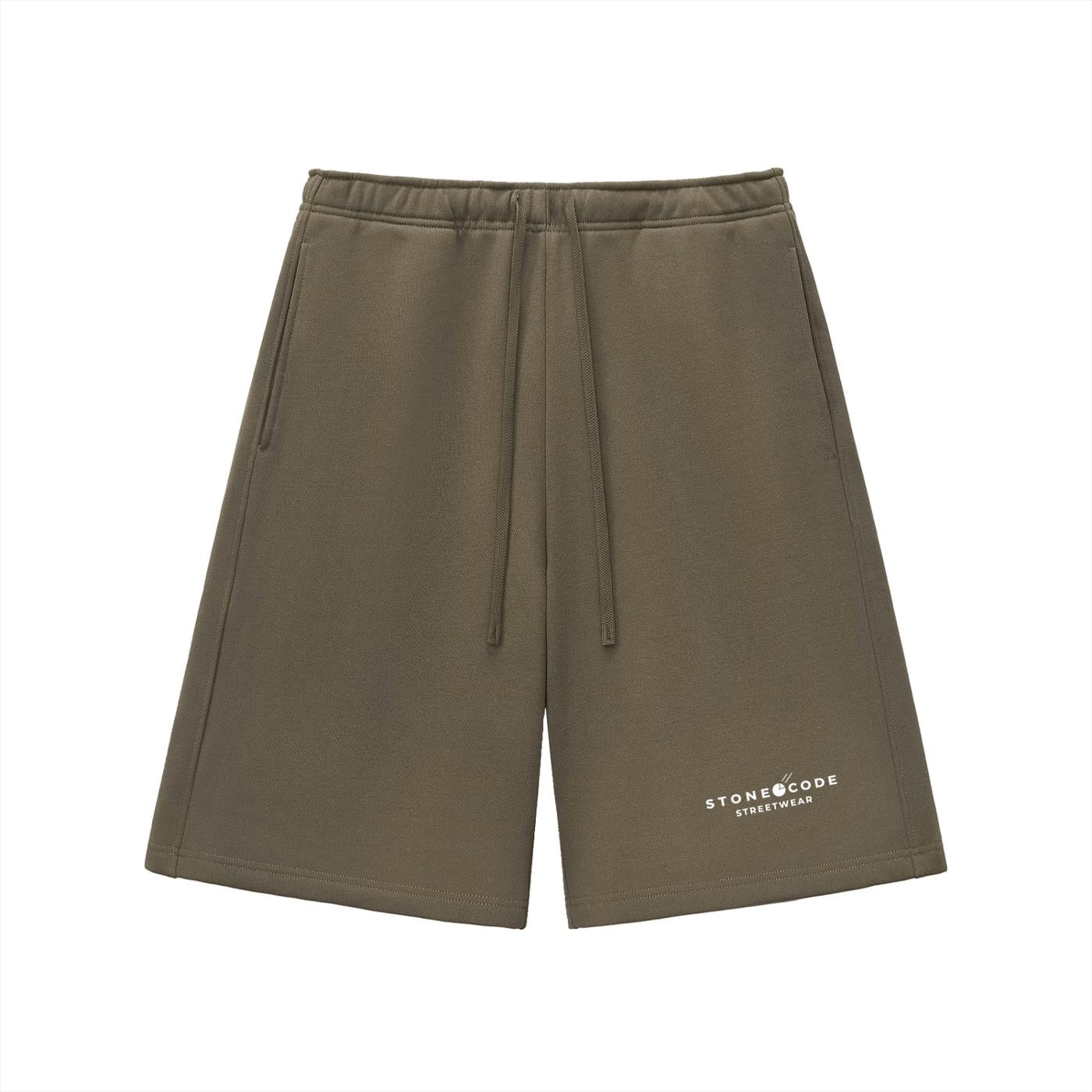 Olive green heavyweight fleece shorts with drawstring waist, side pockets, and "STONECODE STREETWEAR" logo.