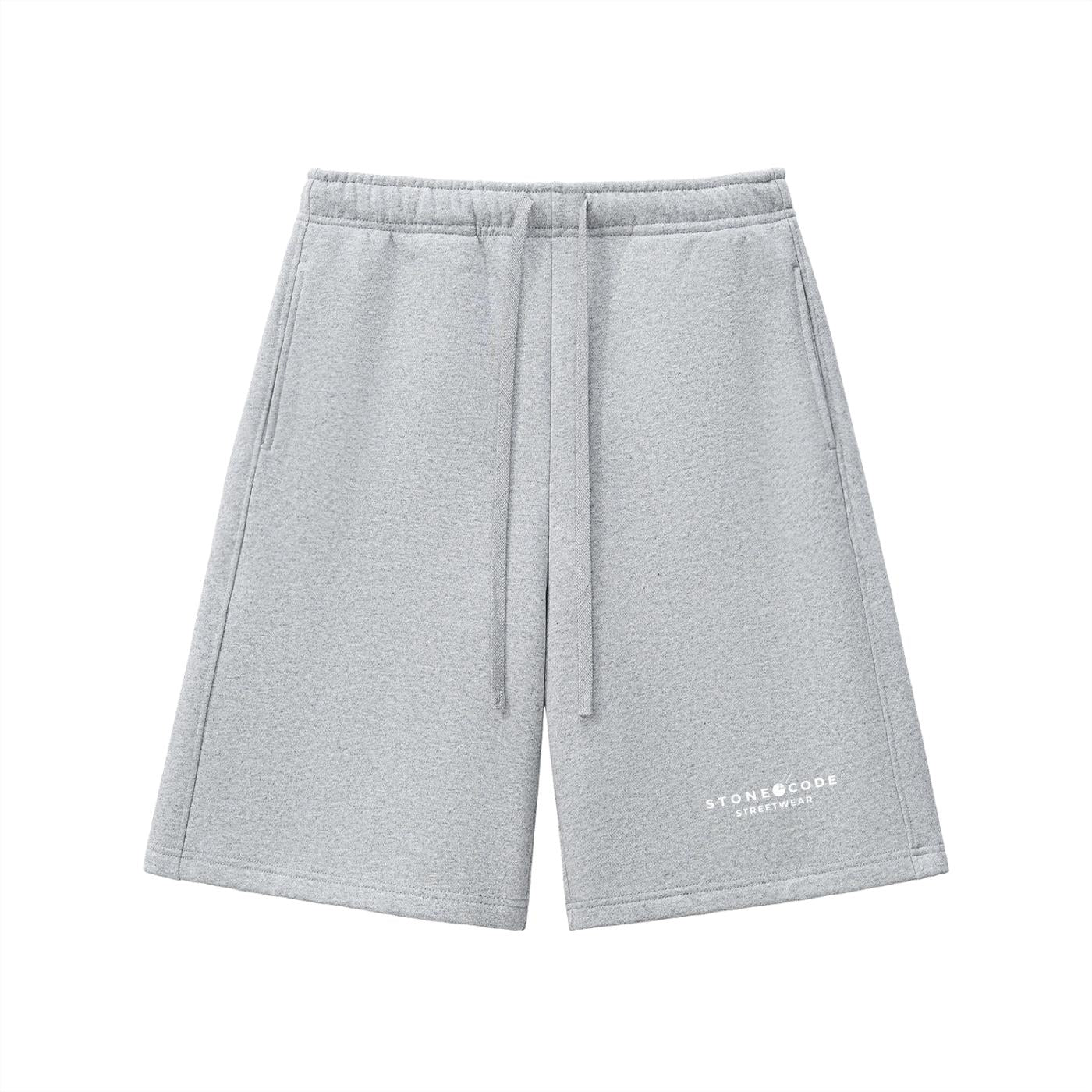 Light grey heavyweight fleece shorts with drawstring waist, side pockets, and "STONE CODE STREETWEAR" logo.