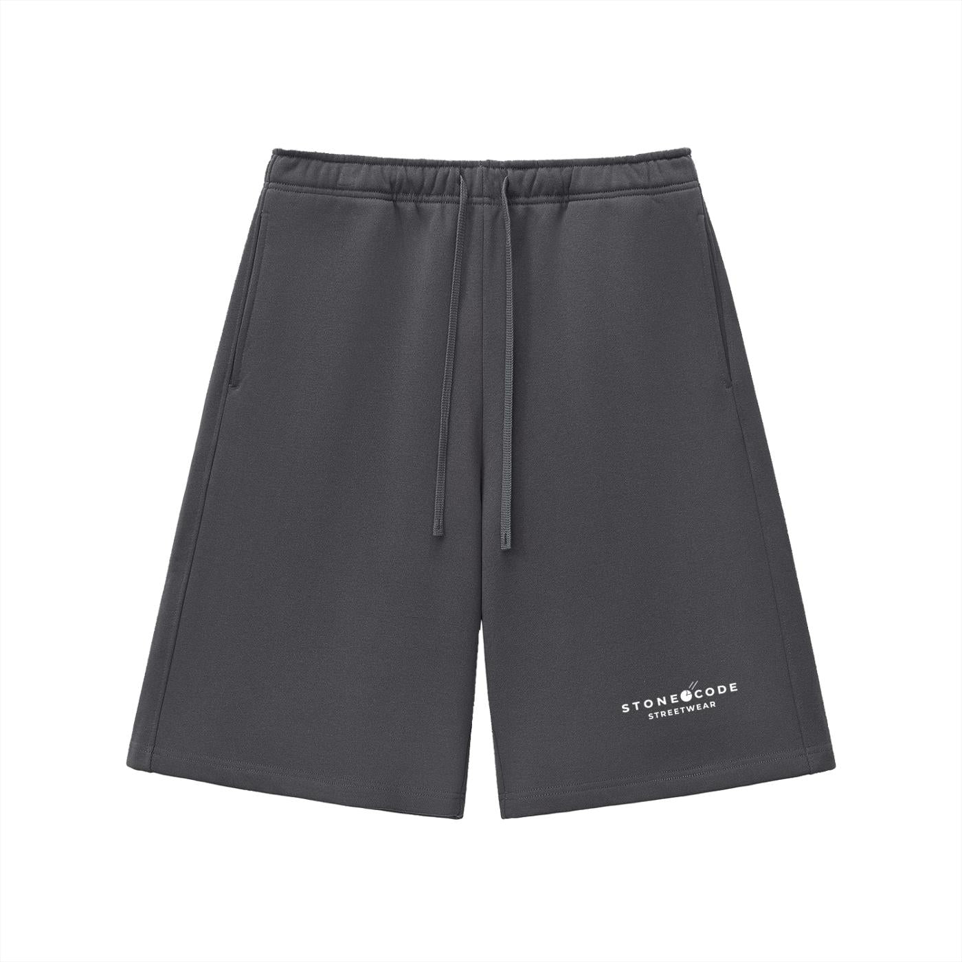 Dark grey heavyweight fleece shorts with drawstring waist and "STONECODE STREETWEAR" logo.