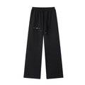 Black women's essential straight-leg sweatpants with elastic waist, drawstring, and "STONE CODE" logo.