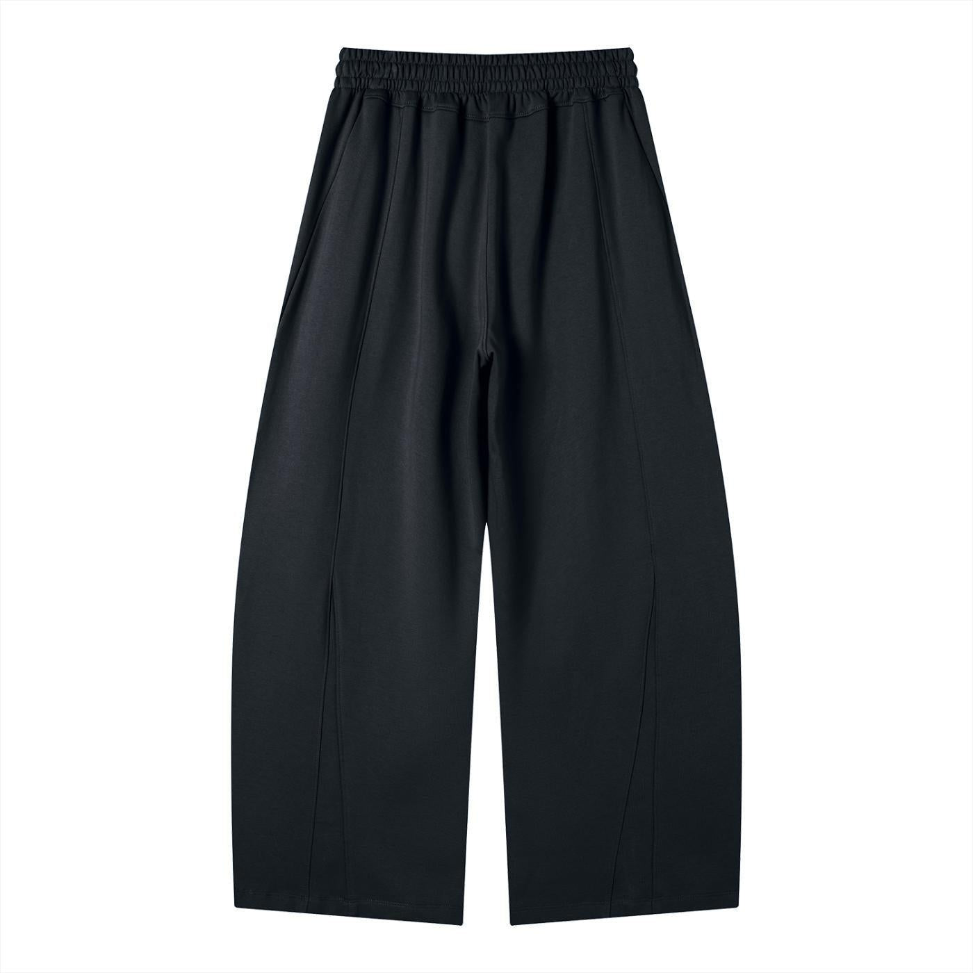 Black heavyweight wide leg panel sweatpants with an elastic waistband and visible seams.