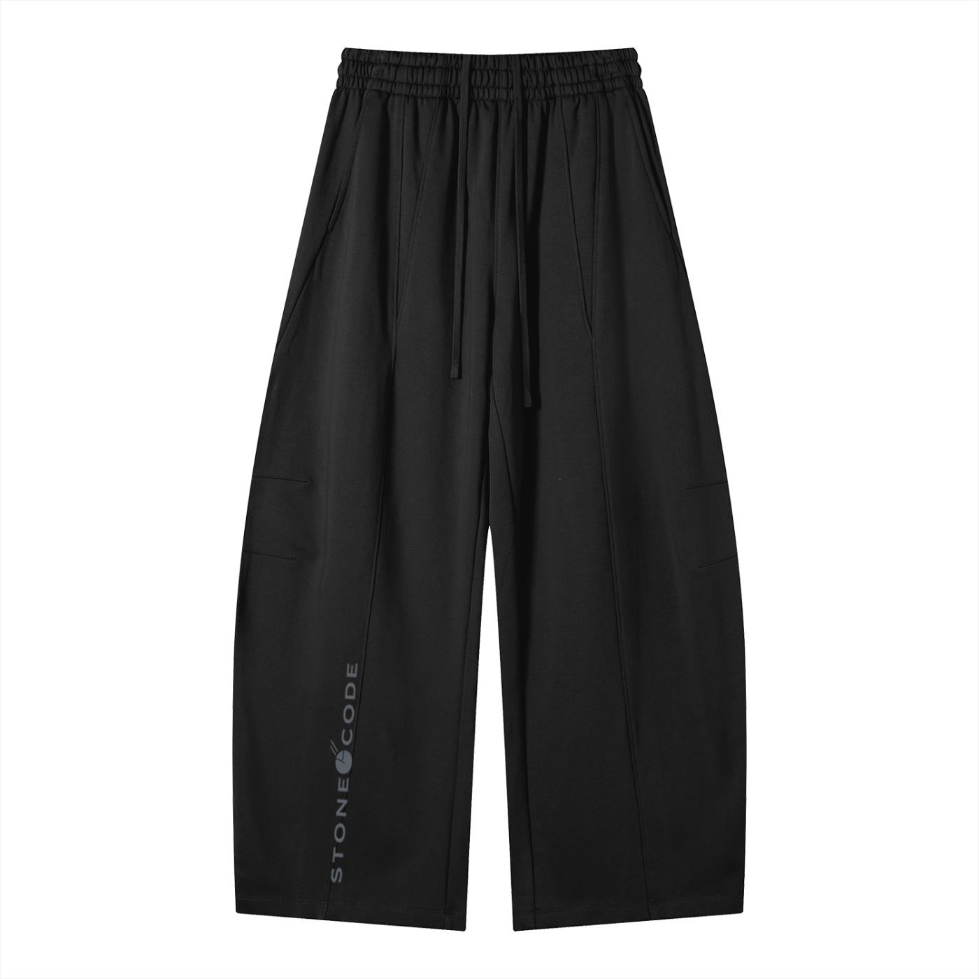 Black heavyweight wide leg panel sweatpants with drawstring waist, side pockets, and "STONE CODE" logo.