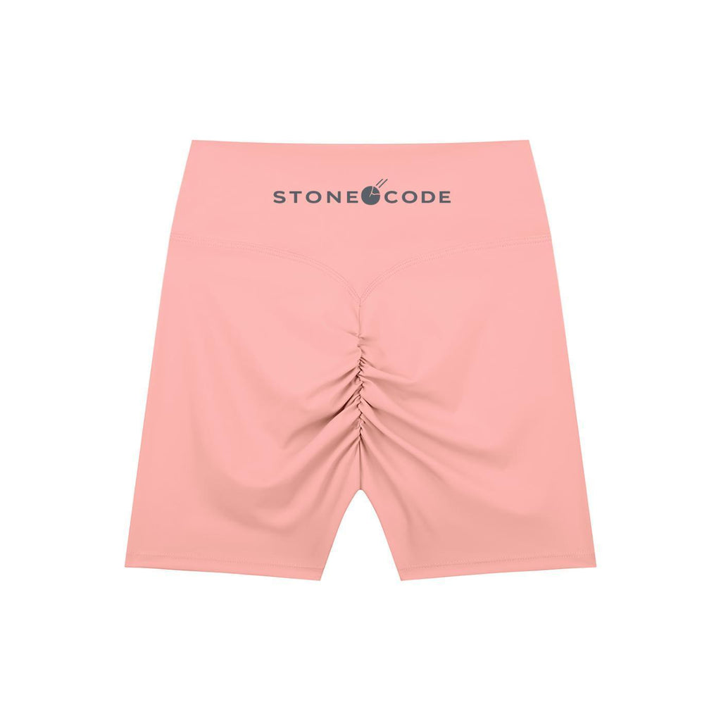 Pink high-waisted biker shorts with a ruched back and "STONE CODE" logo on the waistband.