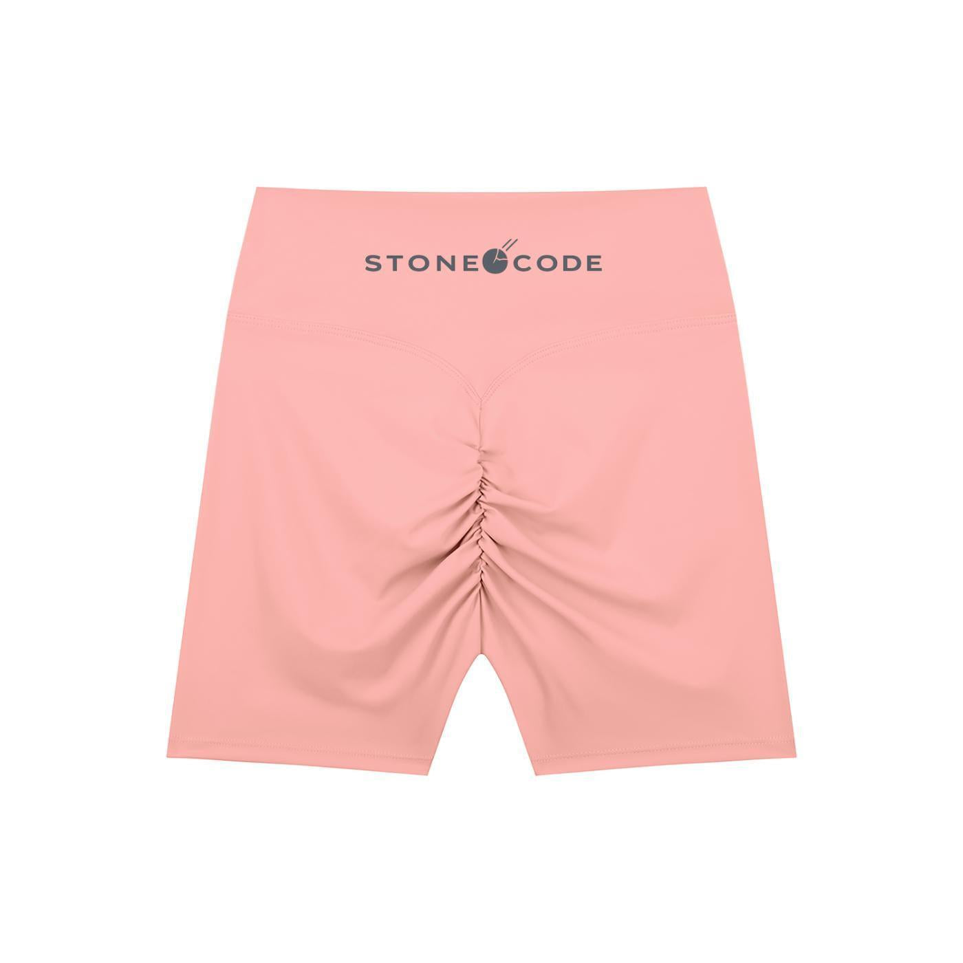 Pink high-waisted biker shorts with a ruched back and "STONE CODE" logo on the waistband.