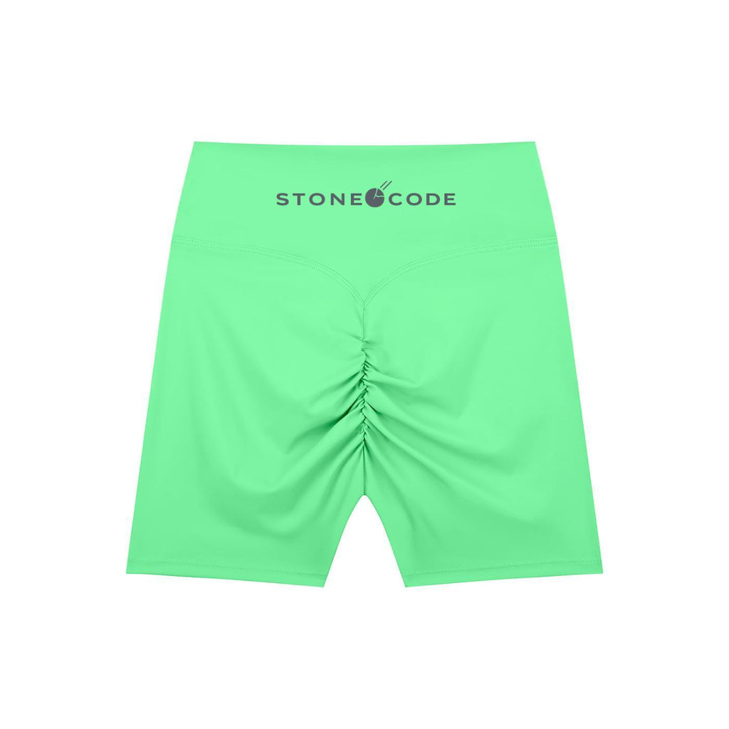 Lime green high-waisted biker shorts with ruched back detail and "STONECODE" logo on the waistband.