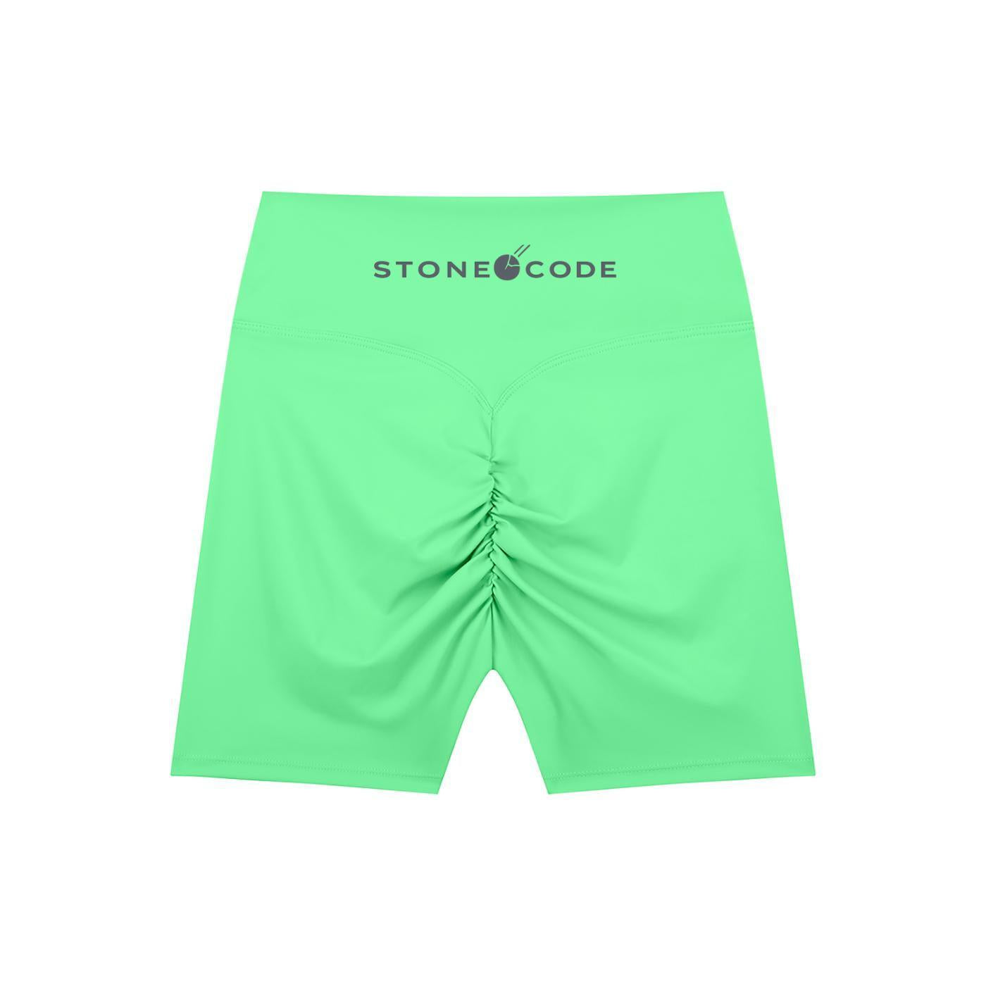 Lime green high-waisted biker shorts with ruched back detail and "STONECODE" logo on the waistband.