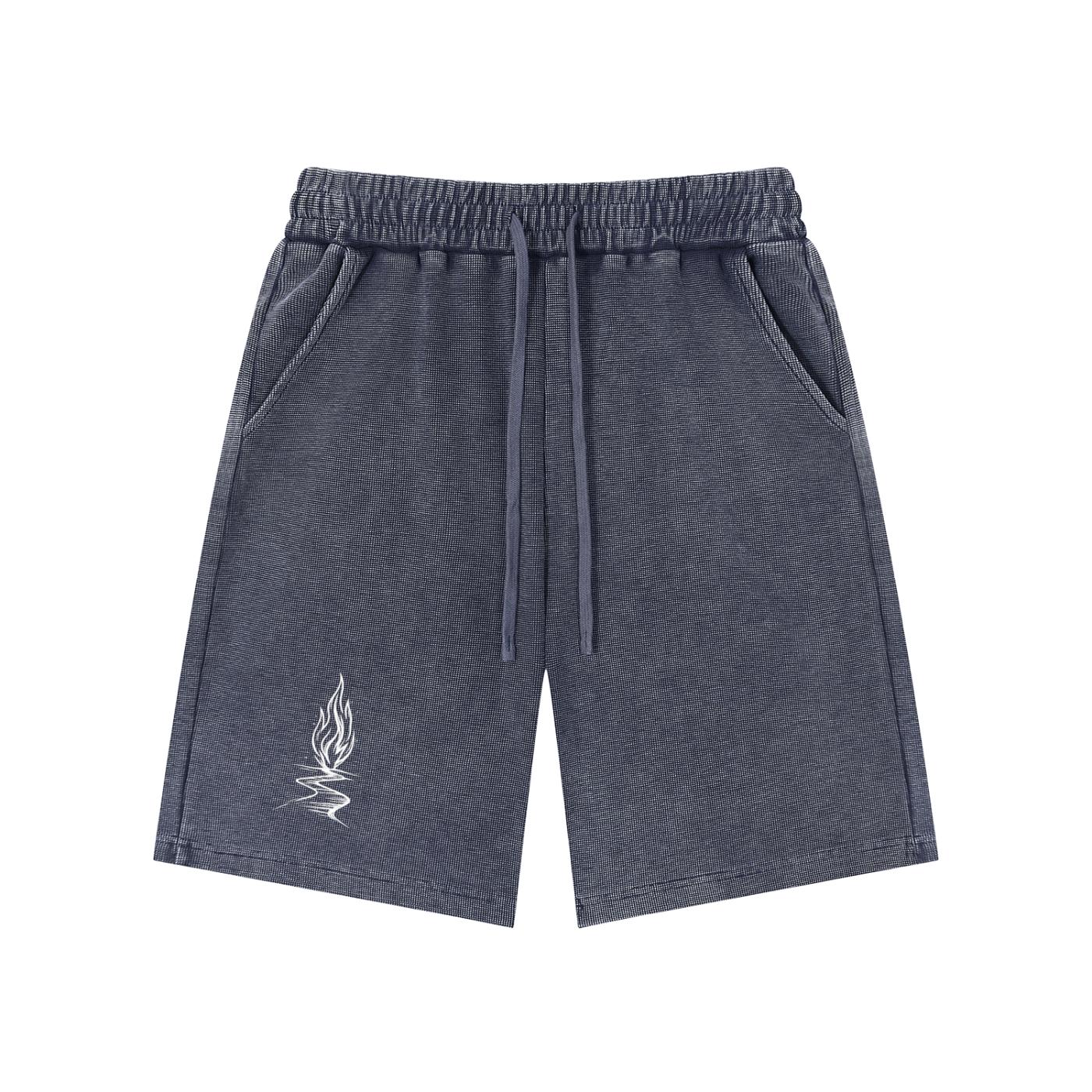 Mineral wash waffle knit shorts in dark gray with a white flame graphic, drawstring waist, and pockets.