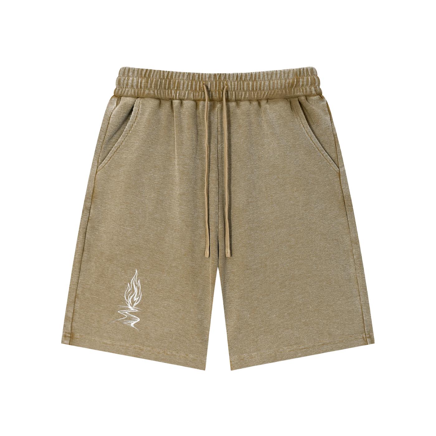Mineral wash waffle knit shorts in a distressed brown with a white flame graphic.