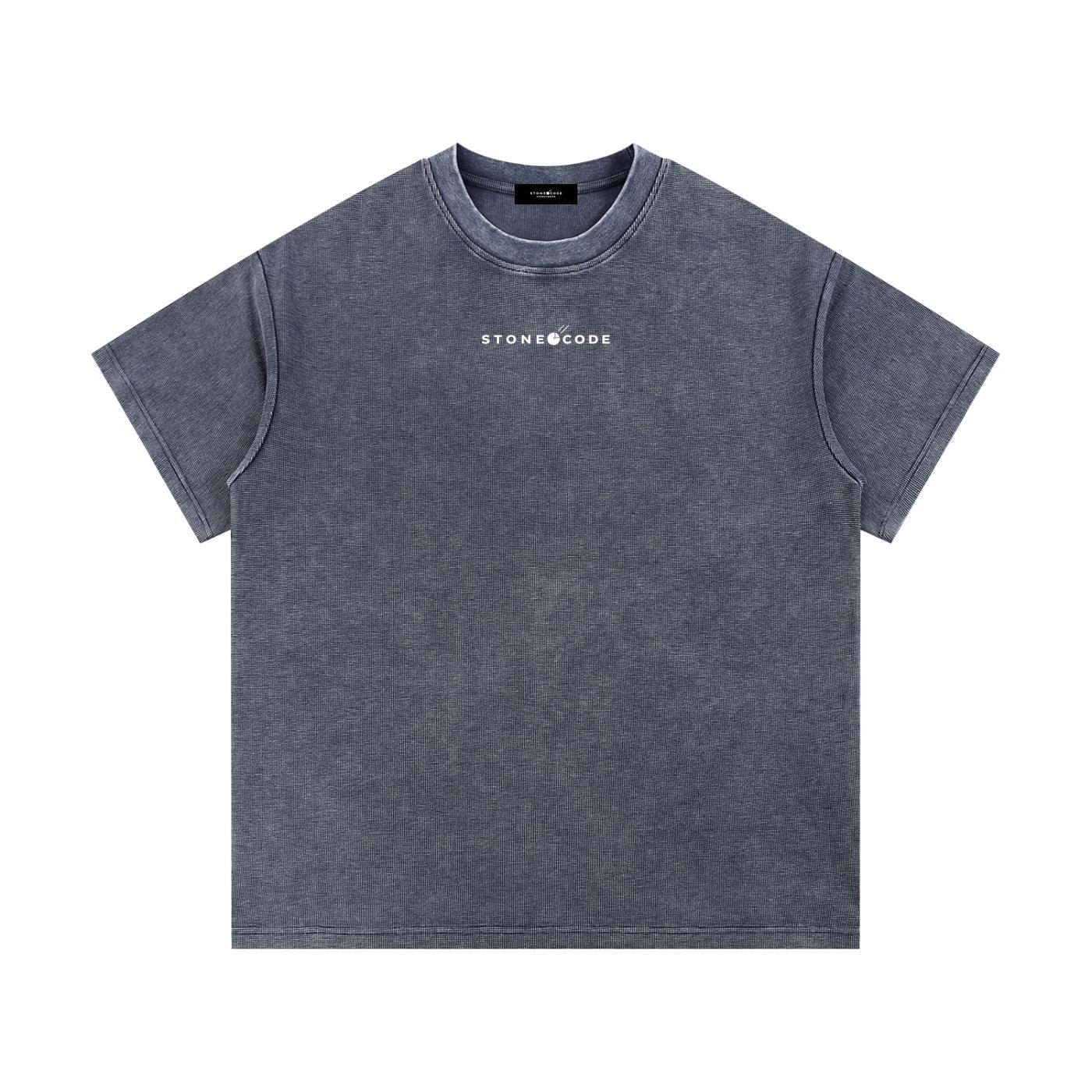 Mineral wash waffle knit t-shirt in dark gray with "STONECODE" logo, short sleeves, and round neck.