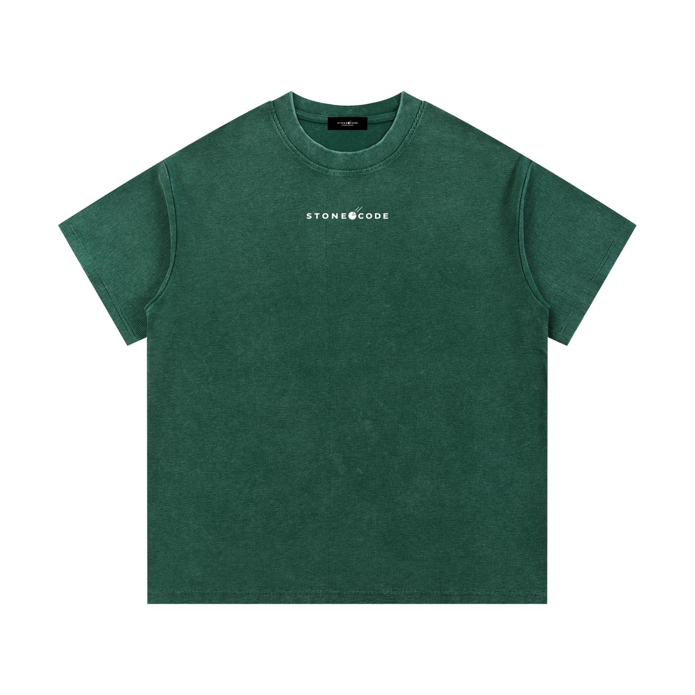 Green mineral wash waffle knit t-shirt with "STONECODE" logo, short drop sleeves, and round neck.