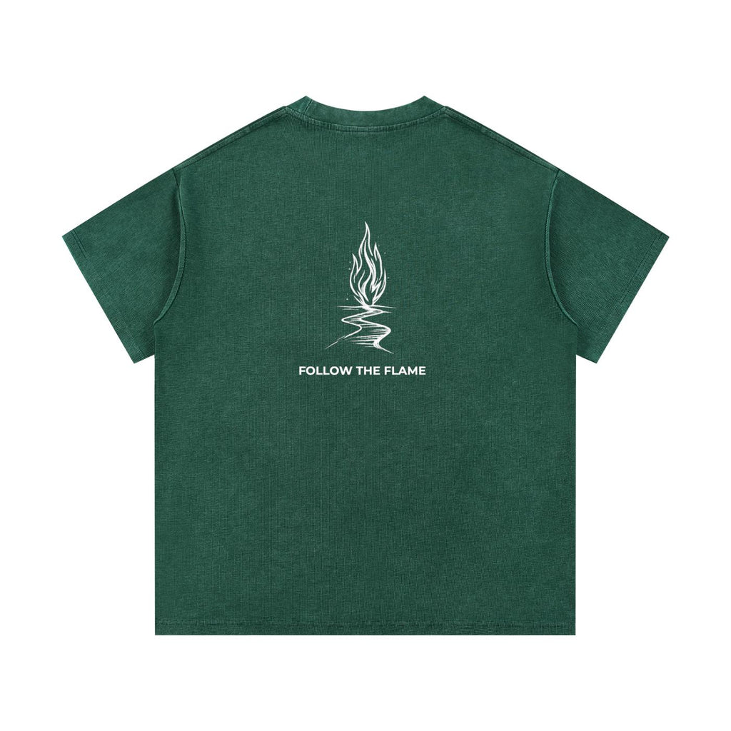 Mineral wash waffle knit t-shirt in dark green with a white "Follow the Flame" graphic on the back.