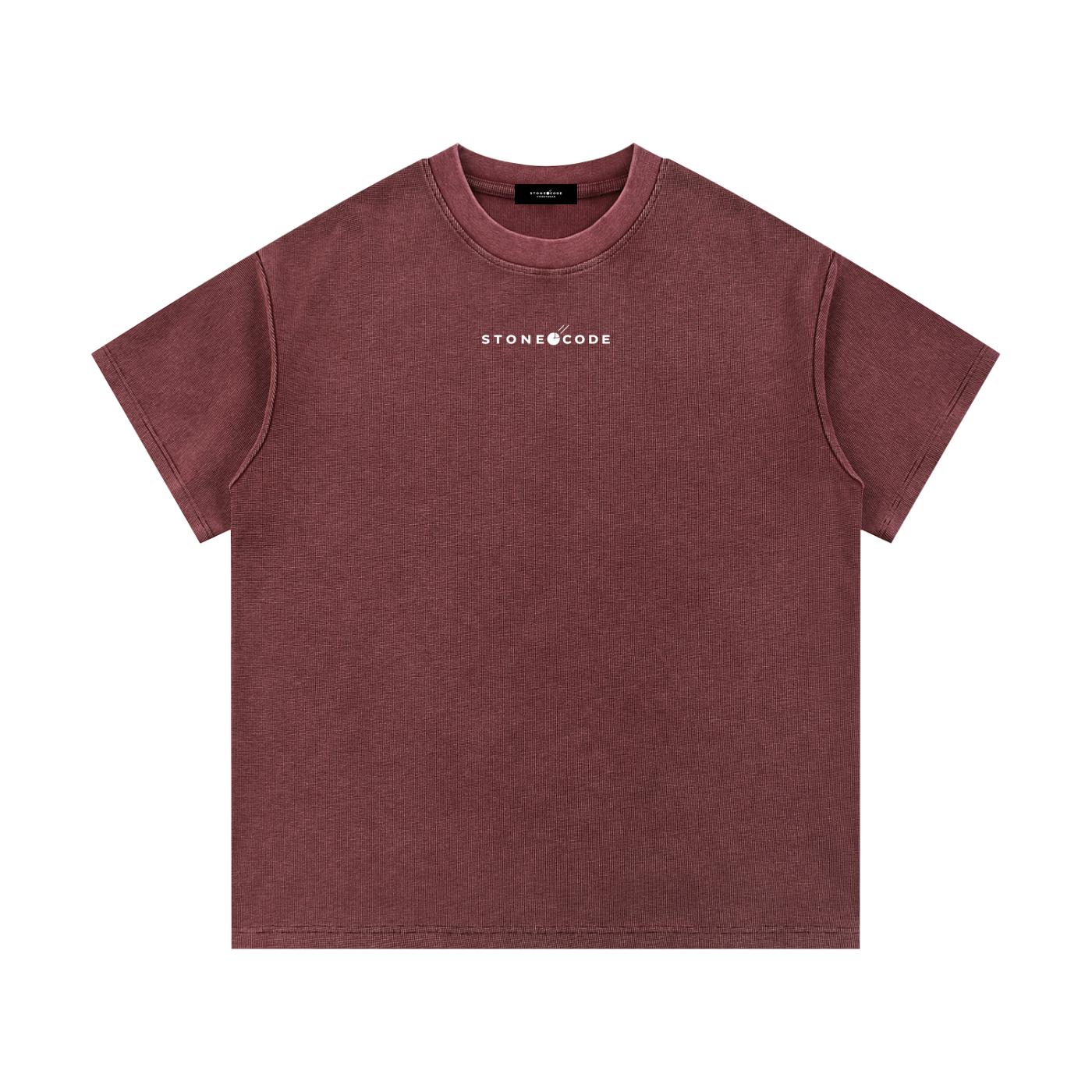 Mineral wash waffle knit t-shirt in a deep red-brown, featuring a white "STONE CODE" logo, drop shoulders, and a round neck.