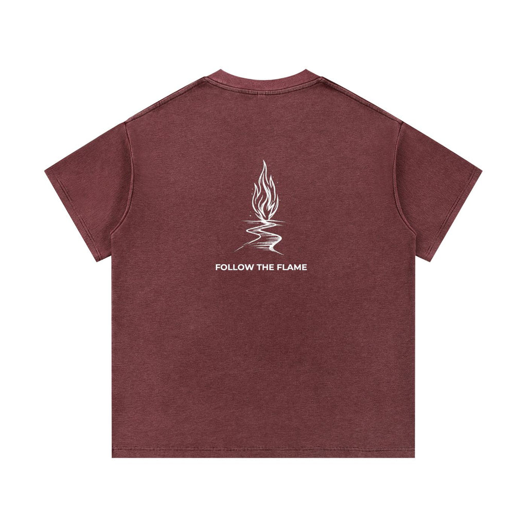 Mineral wash waffle knit t-shirt in dark red with a white "Follow the Flame" graphic on the back.