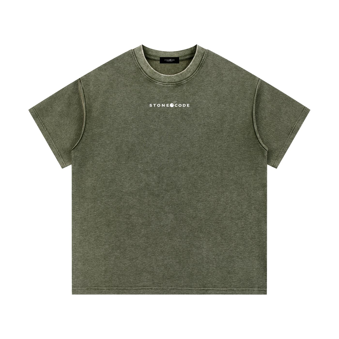Mineral wash waffle knit t-shirt in olive green with "STONECODE" logo, short sleeves, and drop shoulders.
