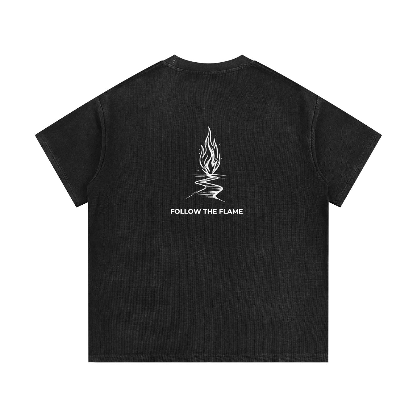 Mineral wash waffle knit t-shirt in black with "Follow the Flame" graphic on back.