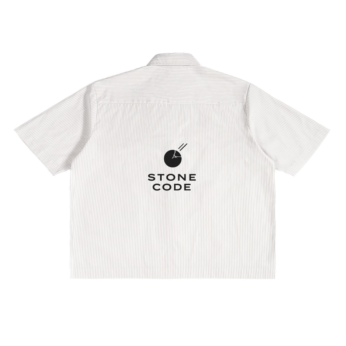 Back of an oversized white polyester boxy shirt with subtle vertical stripes and a black "STONE CODE" logo.