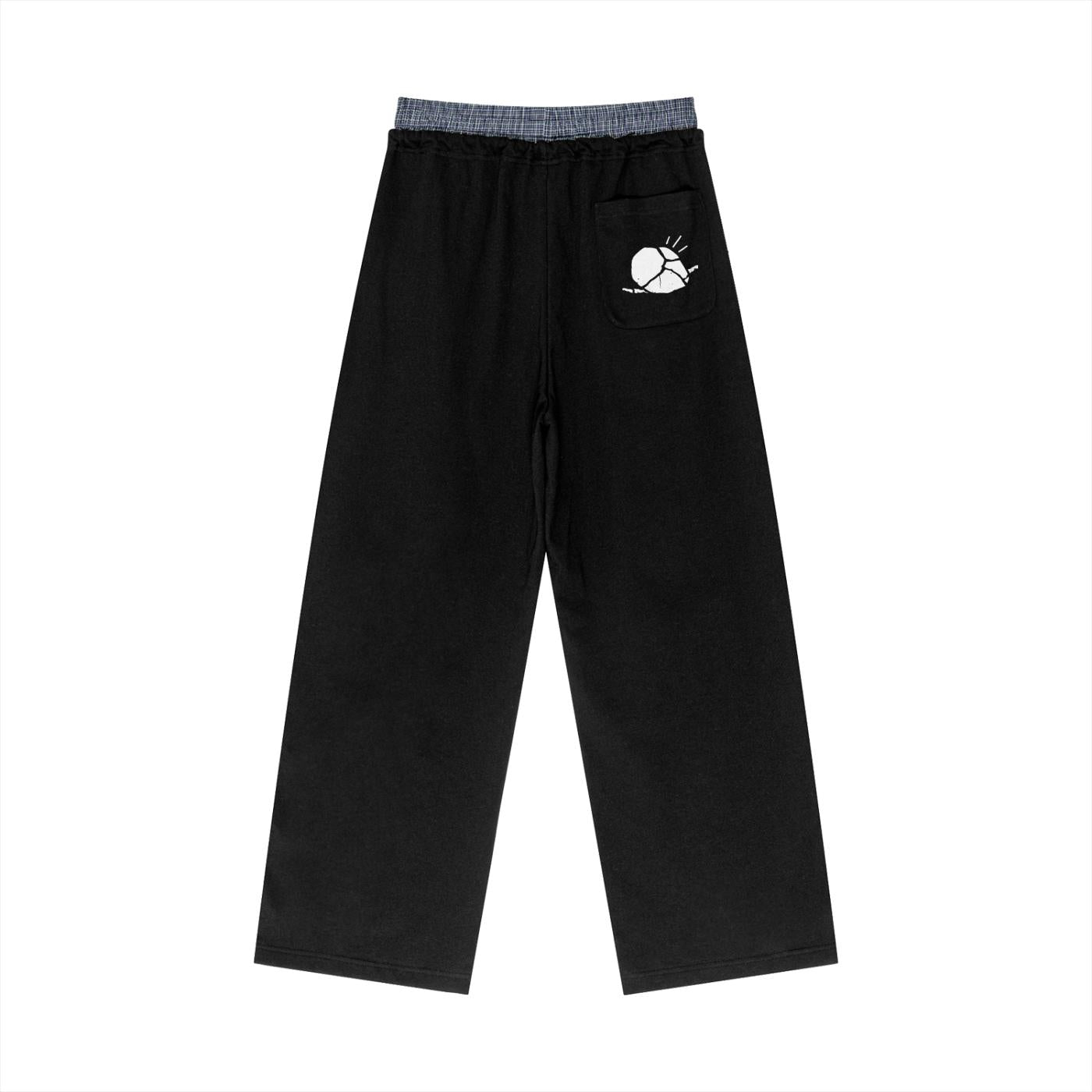 Black unisex plaid contrast waist pants with a white sun graphic on the back pocket.