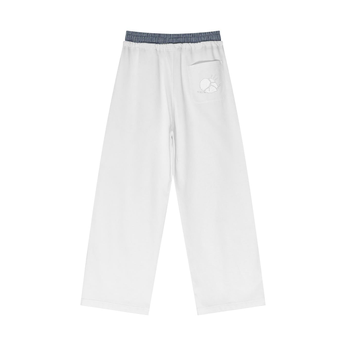 White unisex plaid contrast waist pants with a subtle sun graphic on the back pocket.