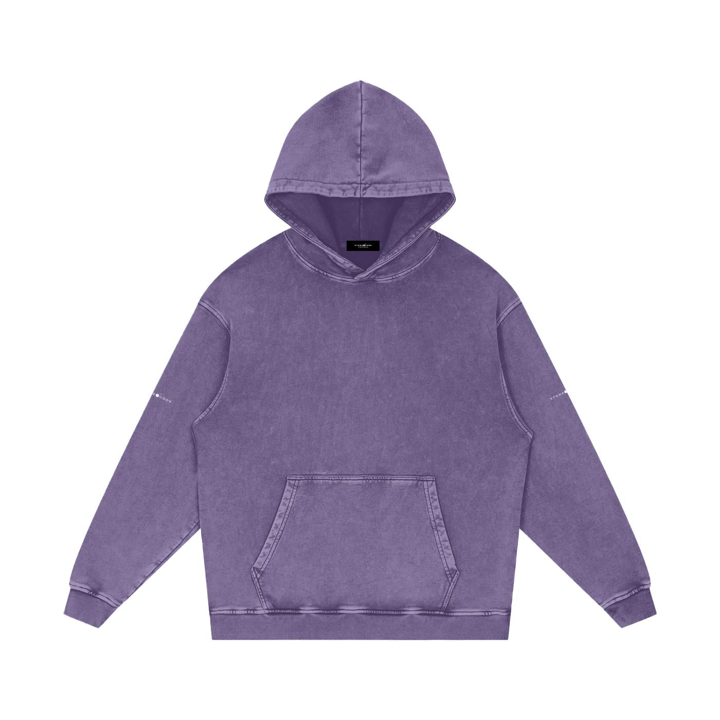 Unisex snow washed loose cotton hoodie in purple with a hood, long sleeves, rib cuffs, and a front kangaroo pocket.