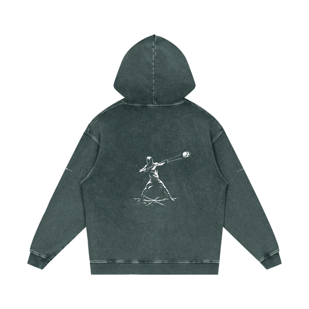 Back view of a snow-washed loose cotton hoodie in dark grey with a white graphic print of a person throwing a ball.