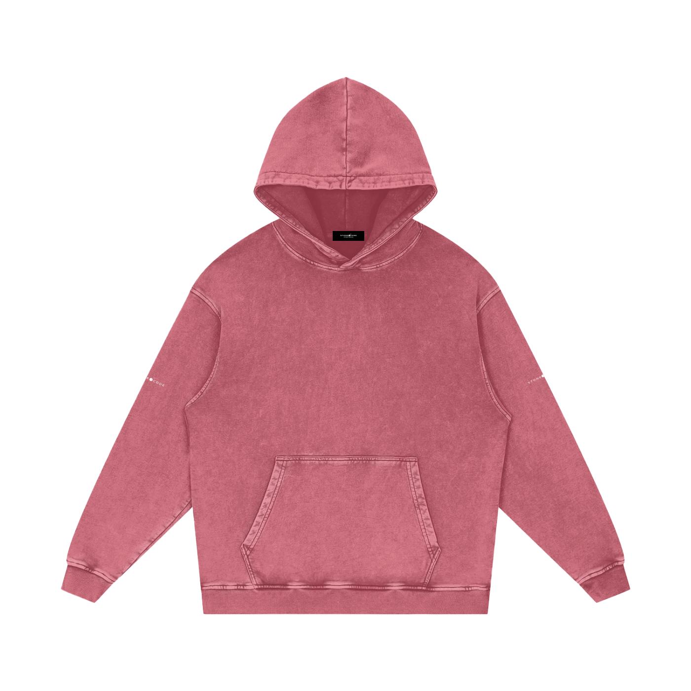 Snow washed loose cotton hoodie in faded red with a front pocket and hood.