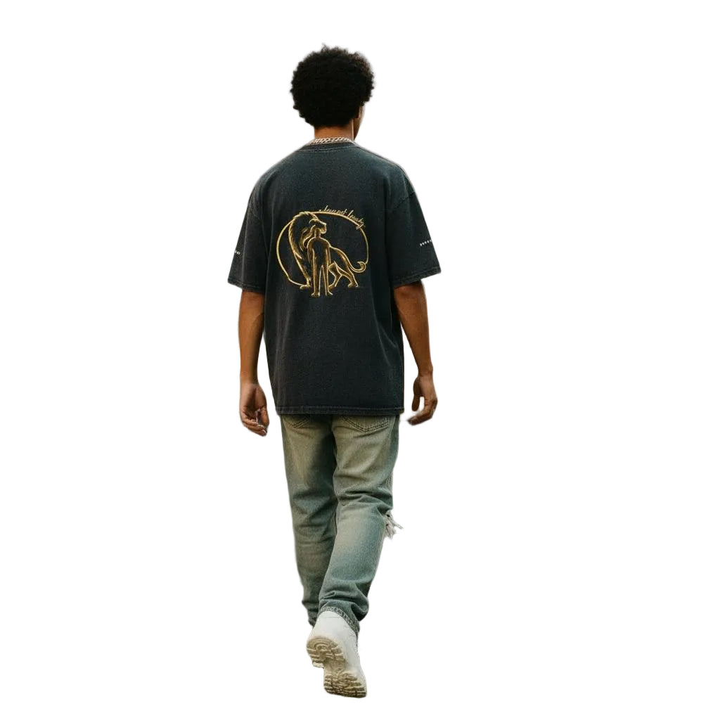 Unisex snow washed oversized cotton t-shirt in dark gray with a gold graphic print on the back.