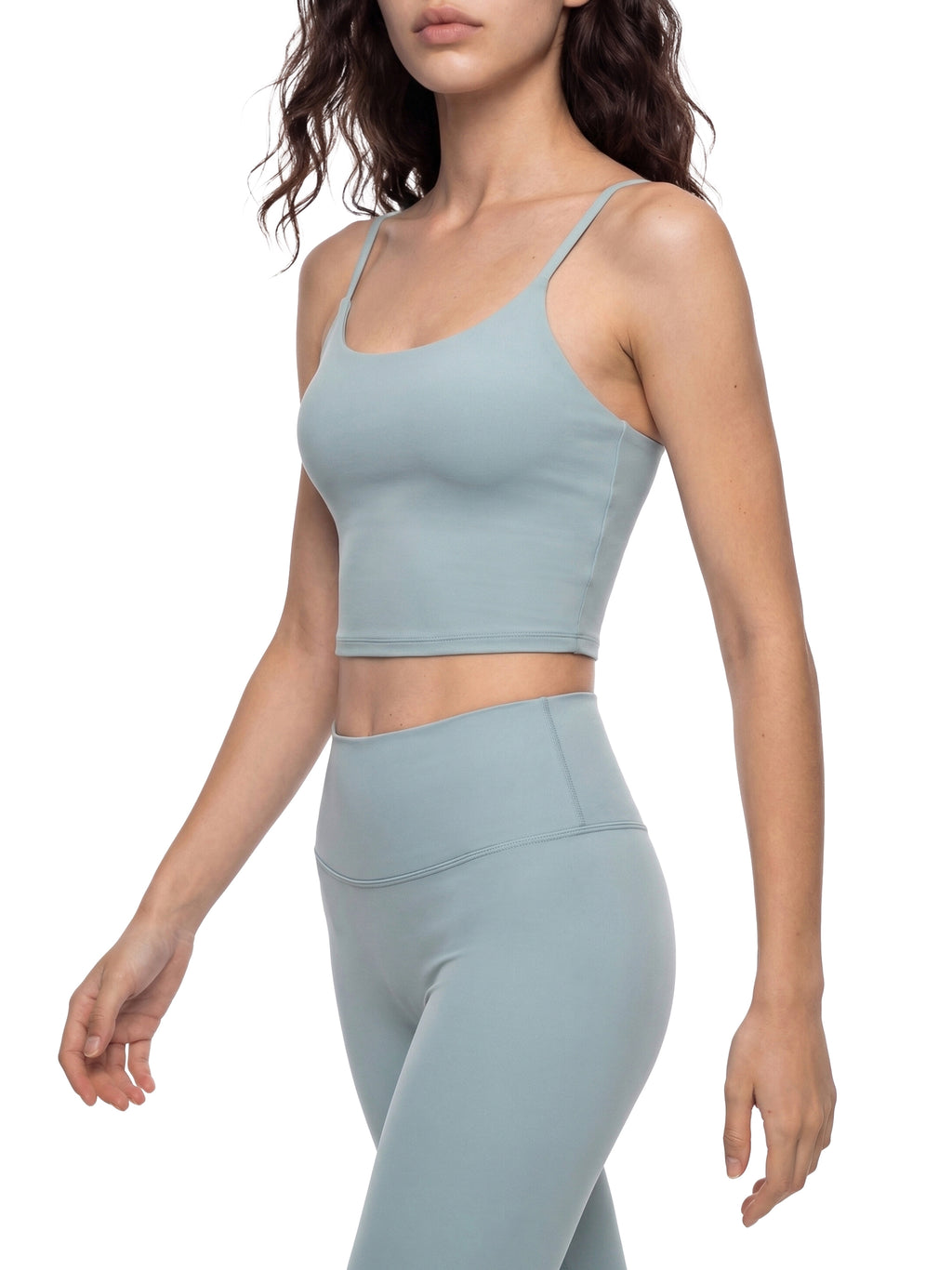 Women's light blue spaghetti strap yoga sports bra and matching leggings.