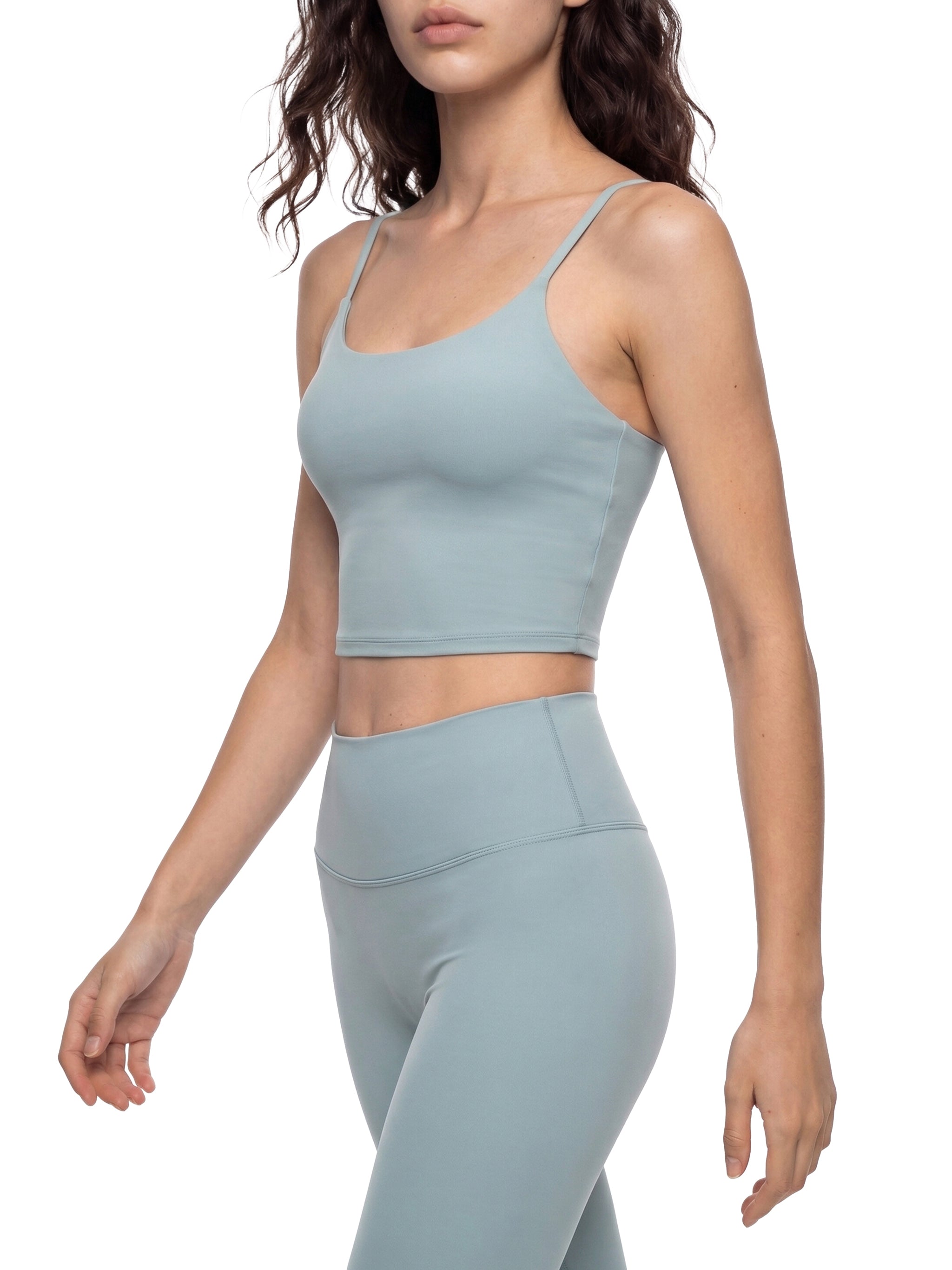 Women's light blue spaghetti strap yoga sports bra and matching leggings.