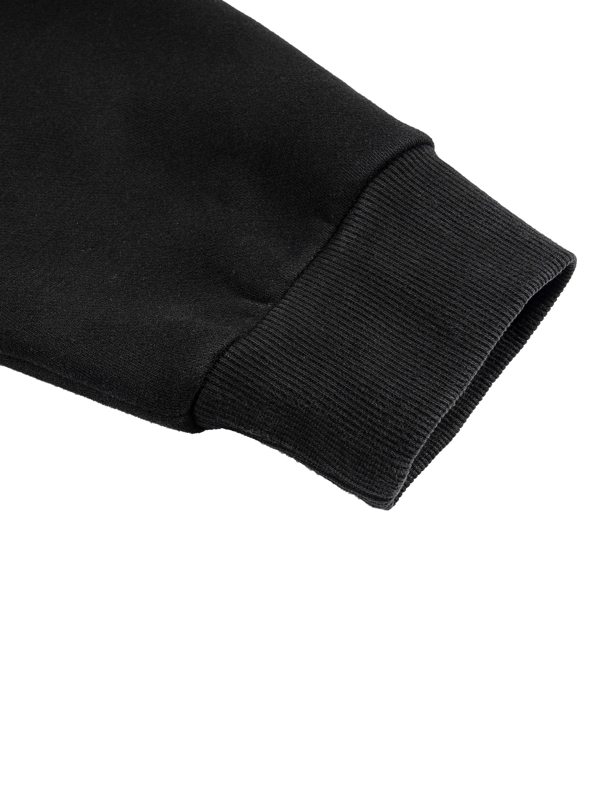 Close-up of a black long sleeve with ribbed cuff, showcasing the cotton blend fabric.